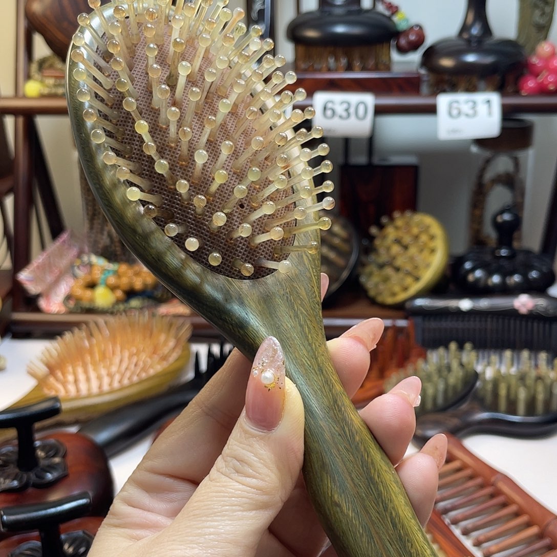 晨***光紫光檀小号羊角气囊梳