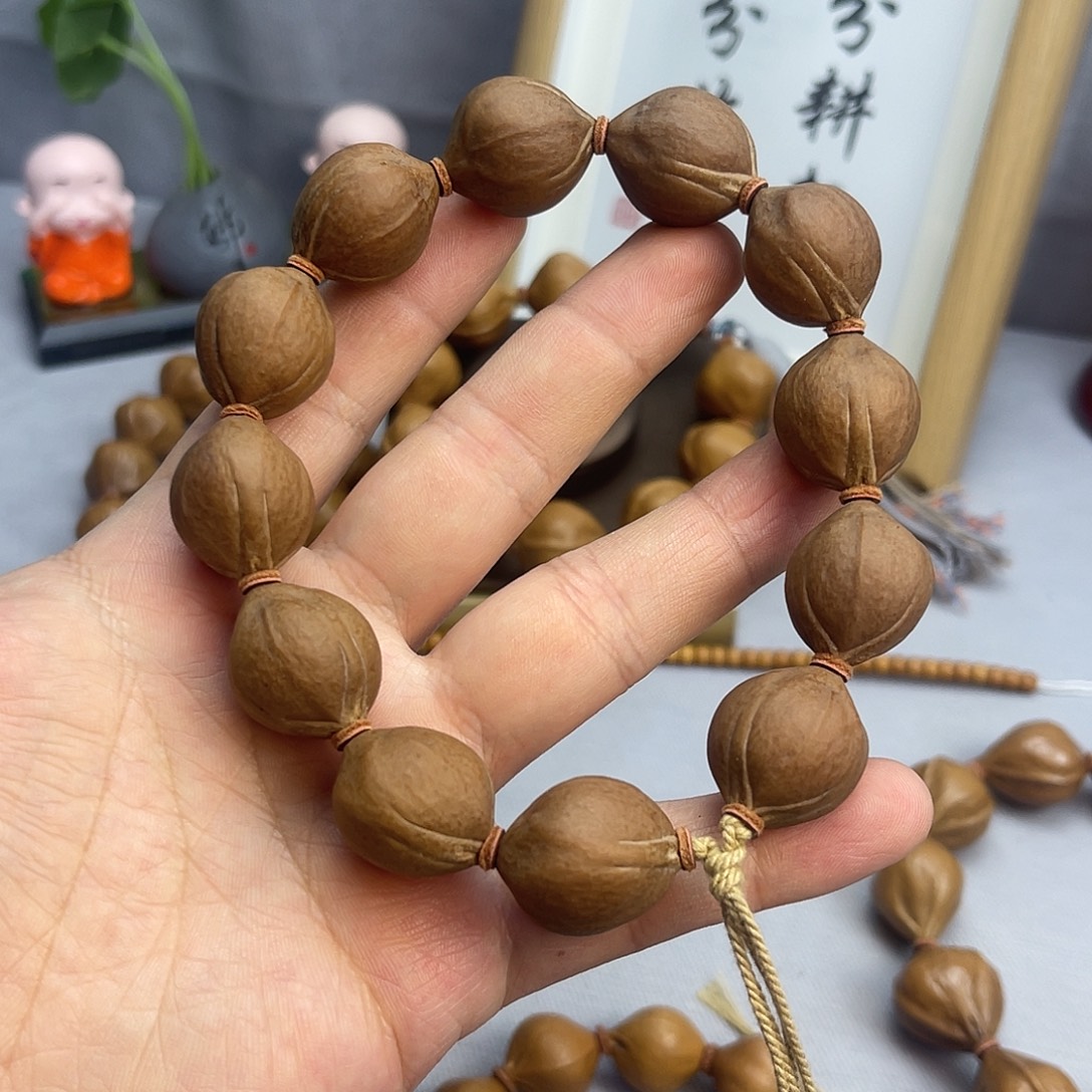 洛***包橄榄核手串矮桩蜜桃