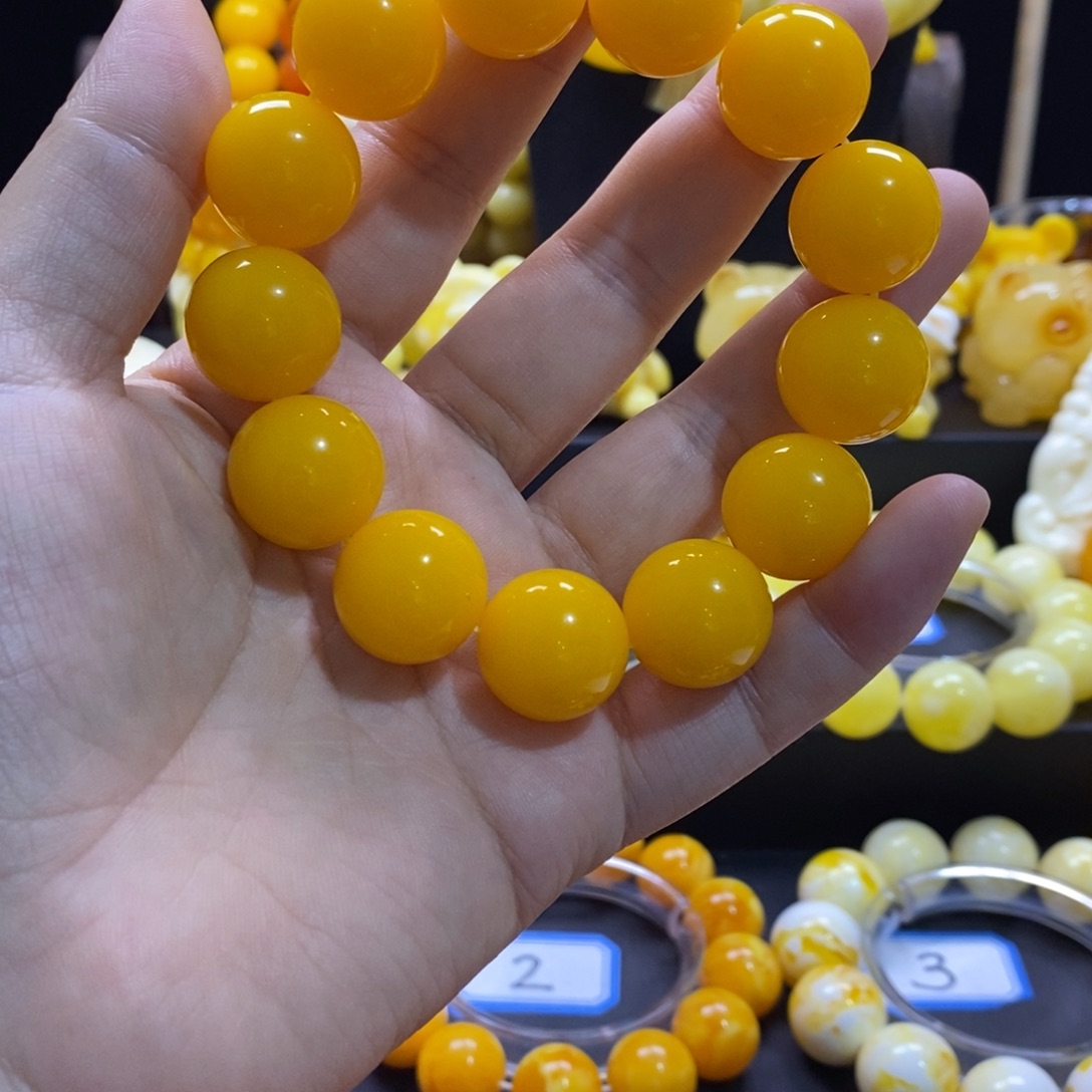 宁***宁树脂非金属鸡油黄手串18