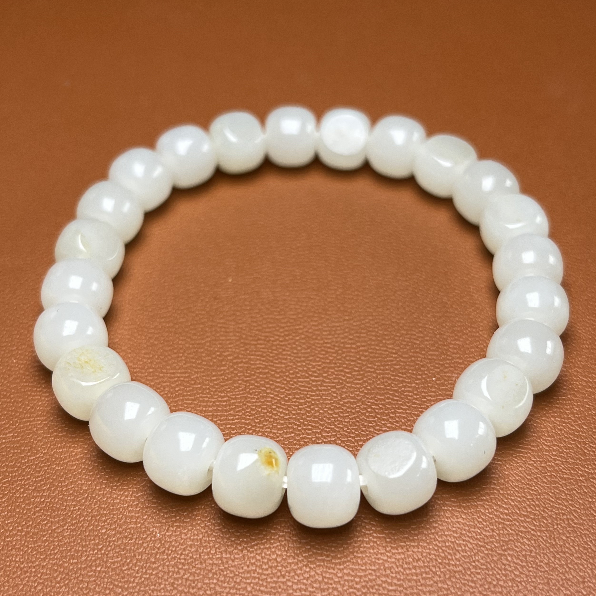 卡9*8老型手串 新疆和田玉 同料10颗留原洒金皮 暖白熟糯