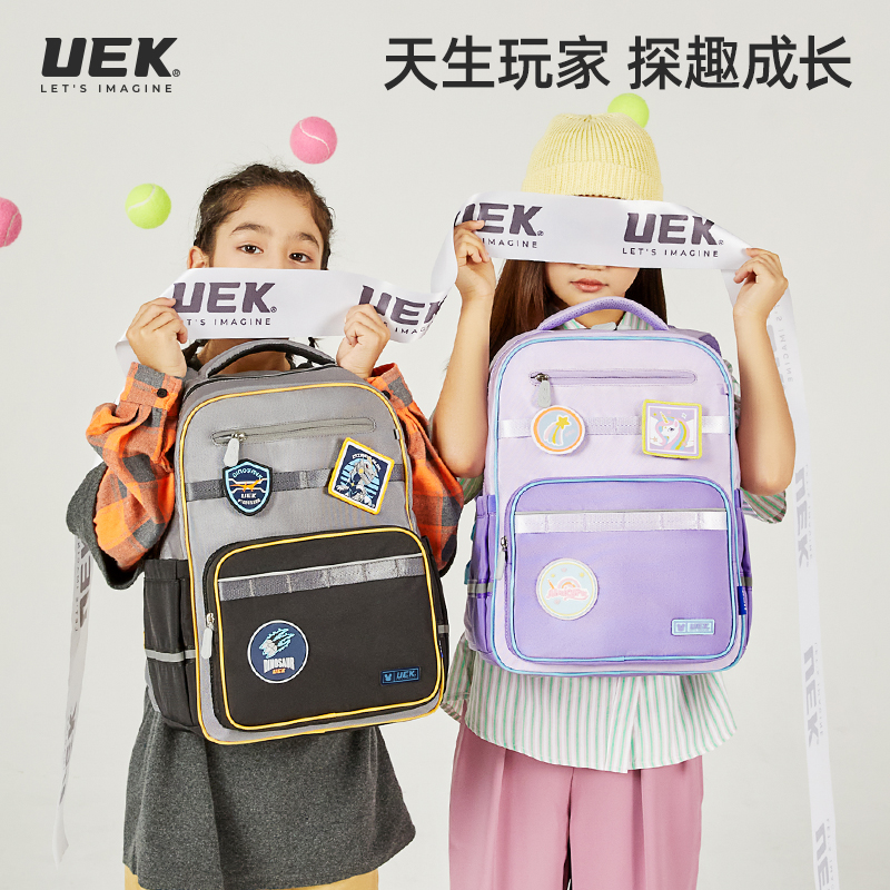 UEK小学生时尚夏季透气休闲超轻简约儿童节防水潮流韩版撞色书包
