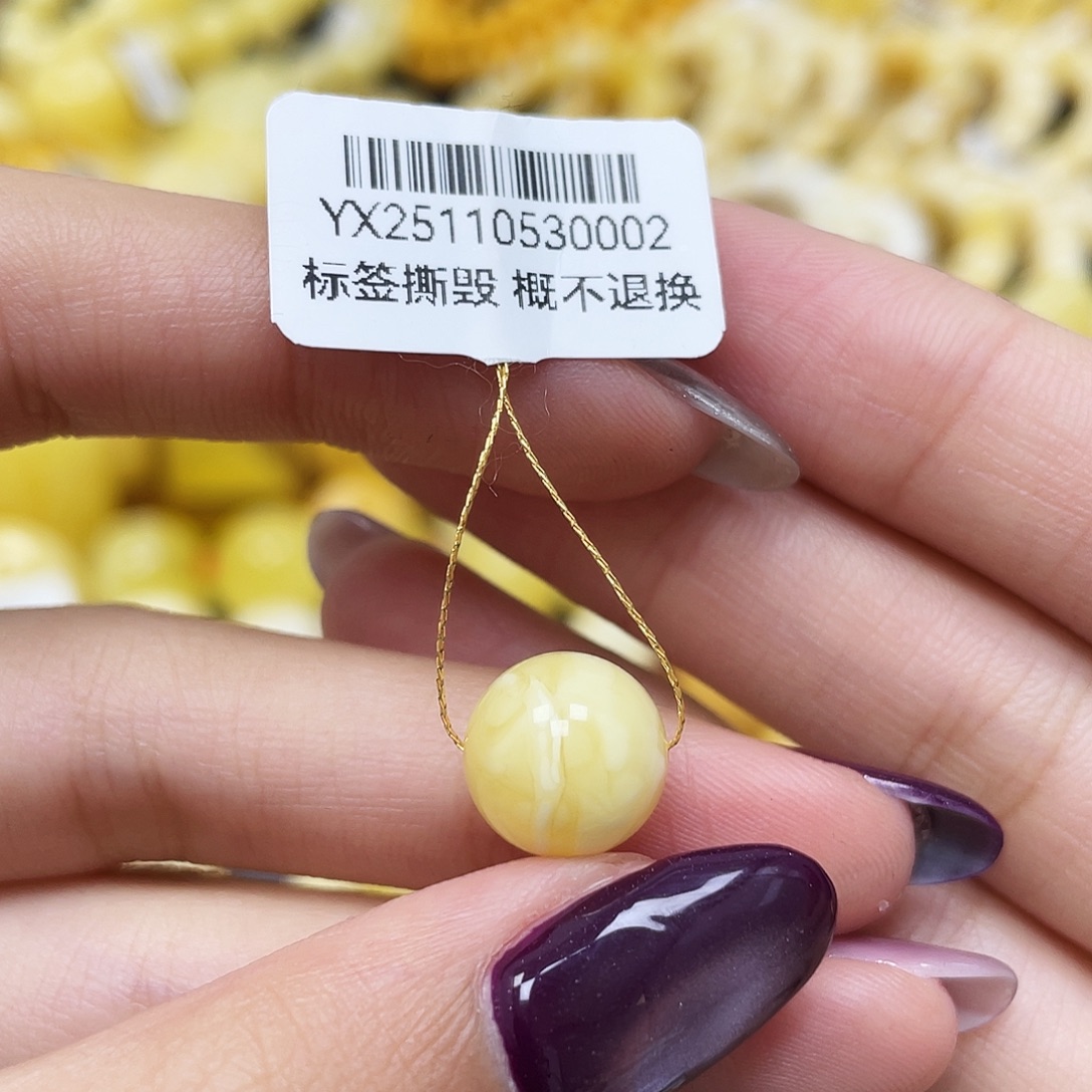 被***泳琥珀未镶嵌裸石10.9mm妖花圆珠蜜蜡