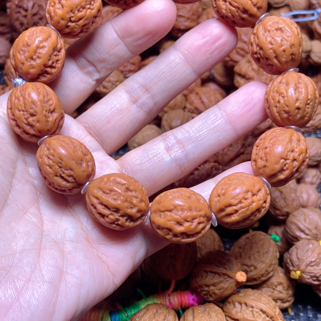 红***果桃核吊坠八棱手串