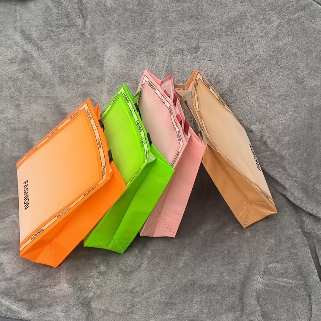 覆膜无纺布服装手提袋环保加厚广告购物袋包装袋两单以上送店名贴