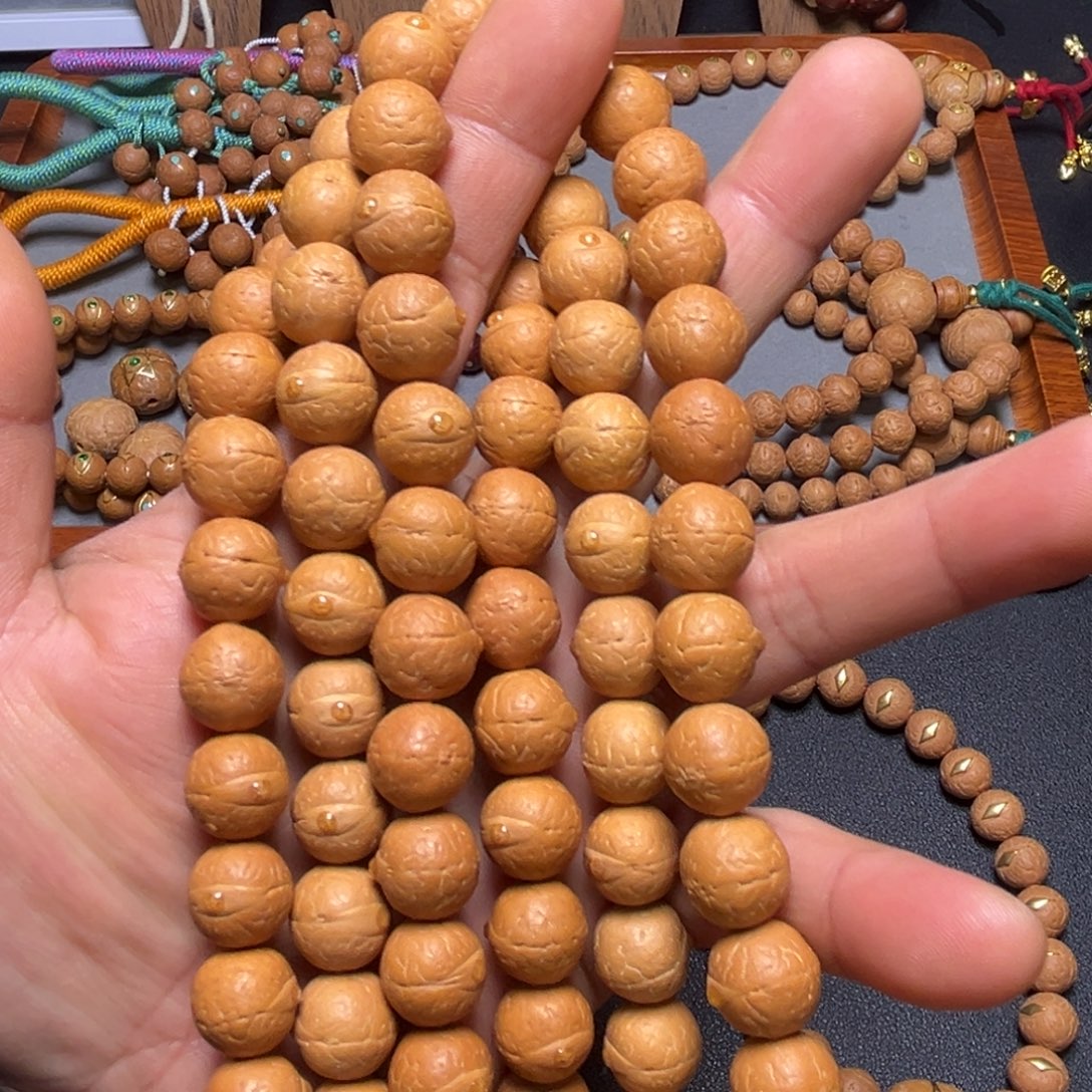 凤眼菩提吊坠12+mm手持