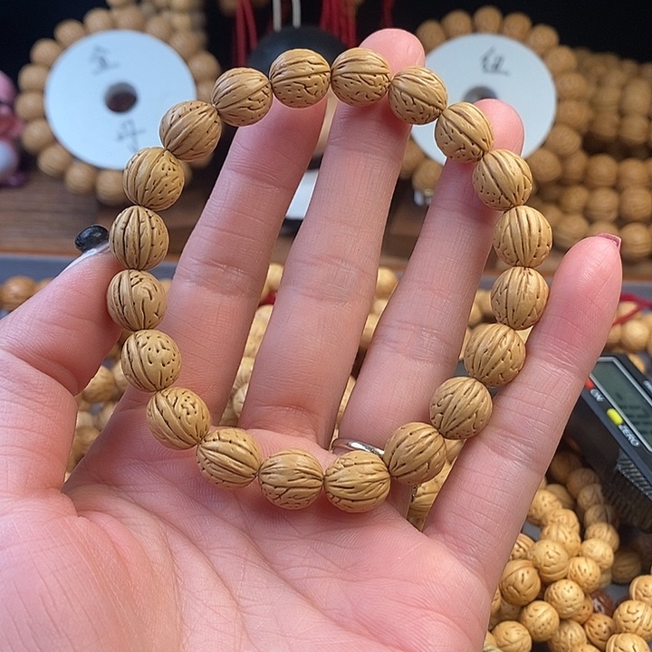 桃核手串凤羽11 （尺寸误差0.5之间）
