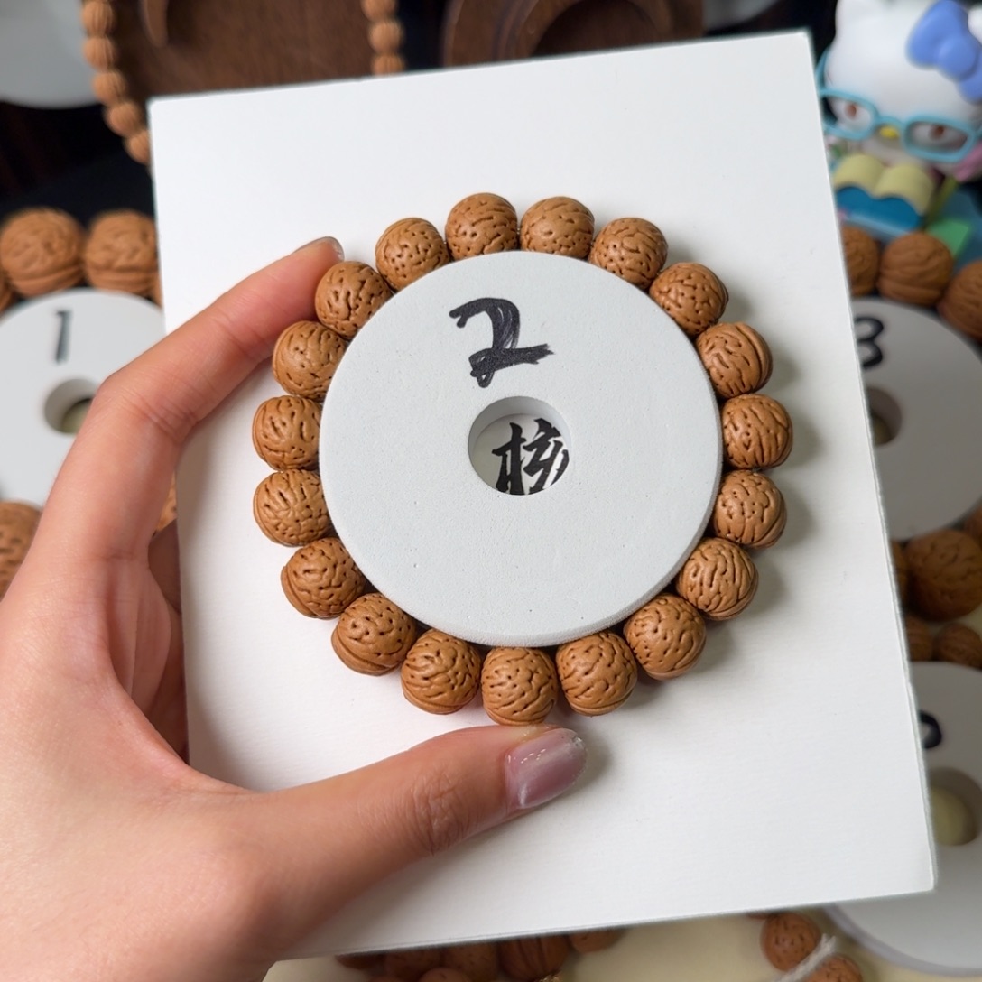 ****安14红皮金丹桃核吊坠