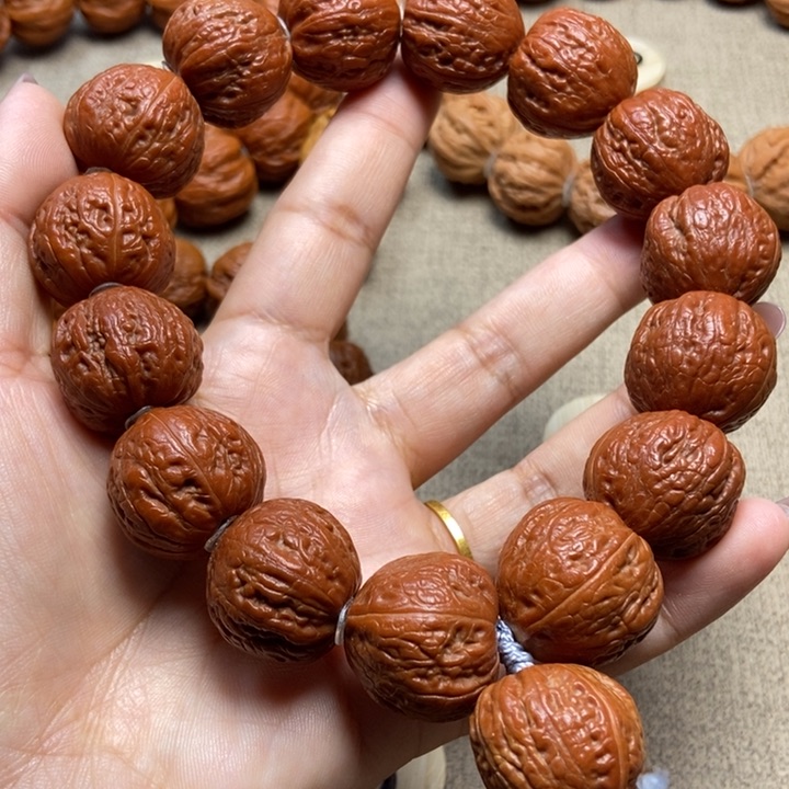 文玩核桃吊坠有*哥红皮火柿子