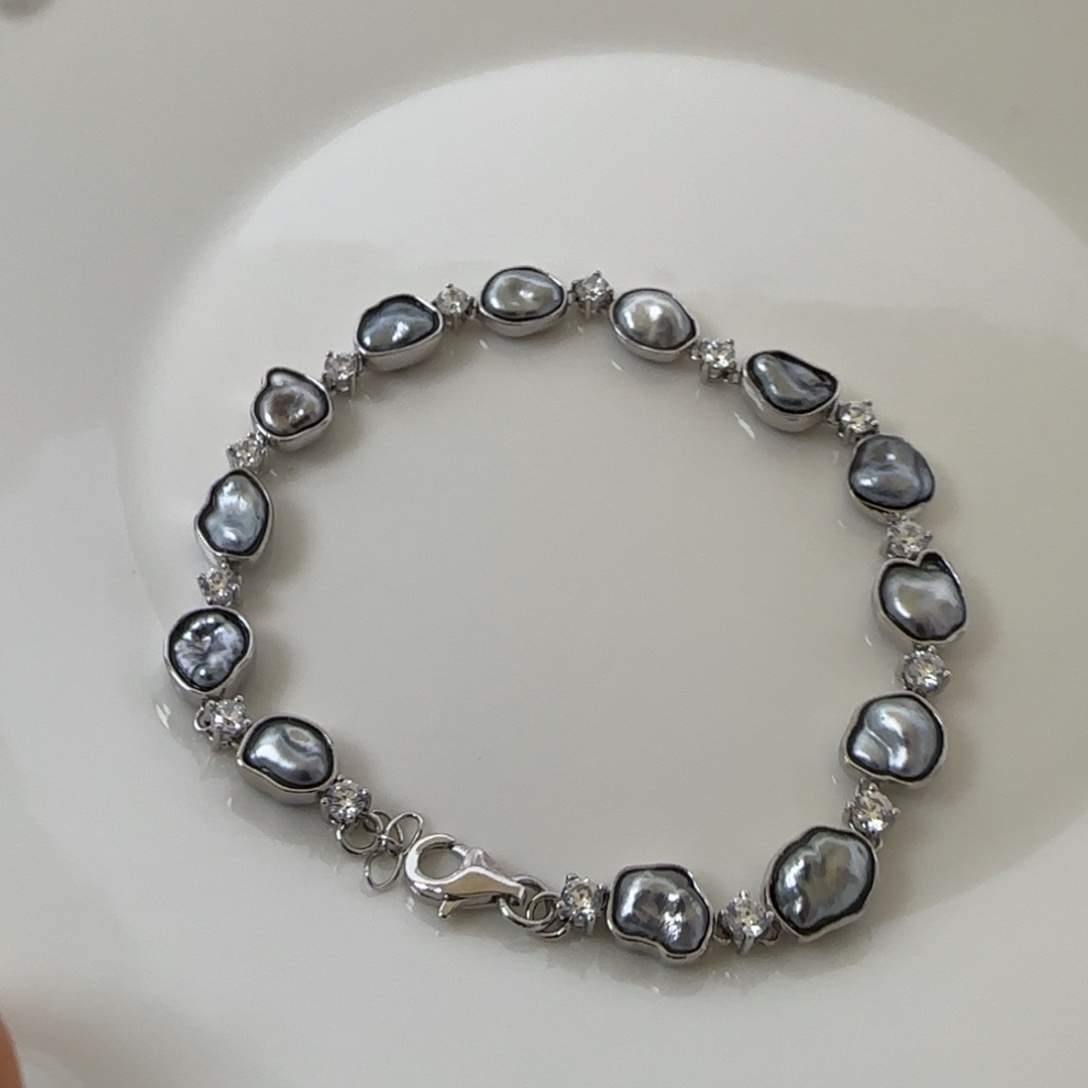 。***。银S925镶嵌海水珍珠手链