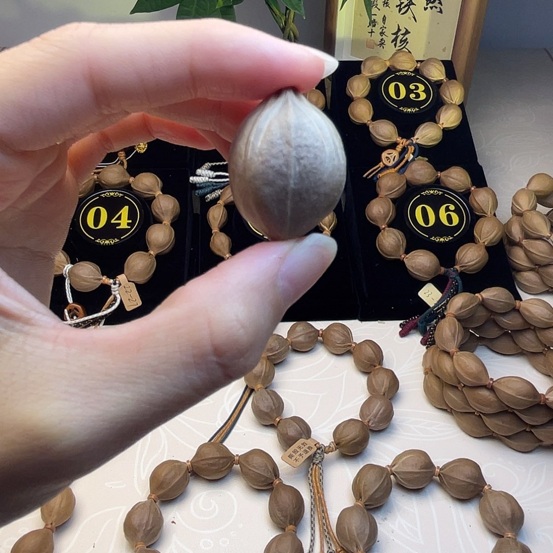 亿***龙橄榄核手串梅林铁核四花21*28