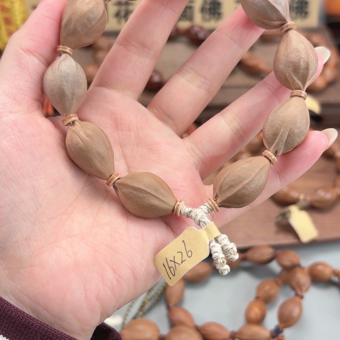 玩***火橄榄核手串三面佛