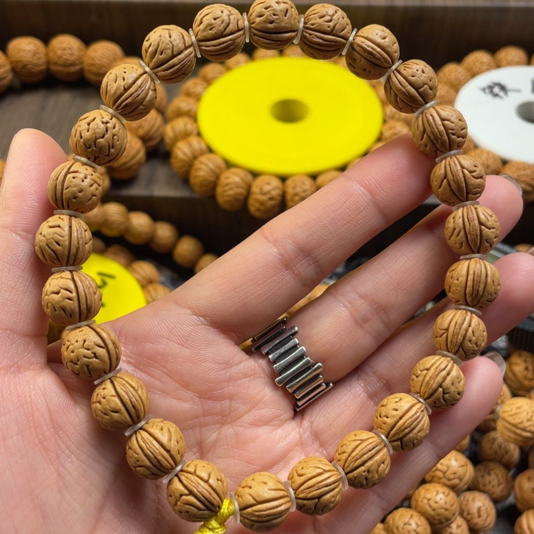 桃核手串广**馆野生三棱