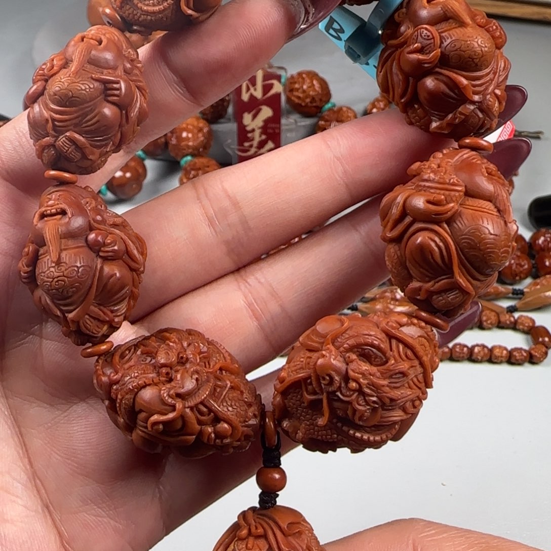 橄榄核手串/手链宽2.3鸡血红水晶核龙财神