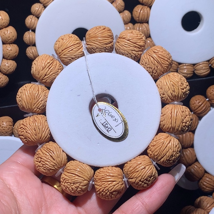 桃核手串高****?桃核手串龙鳞凤尾