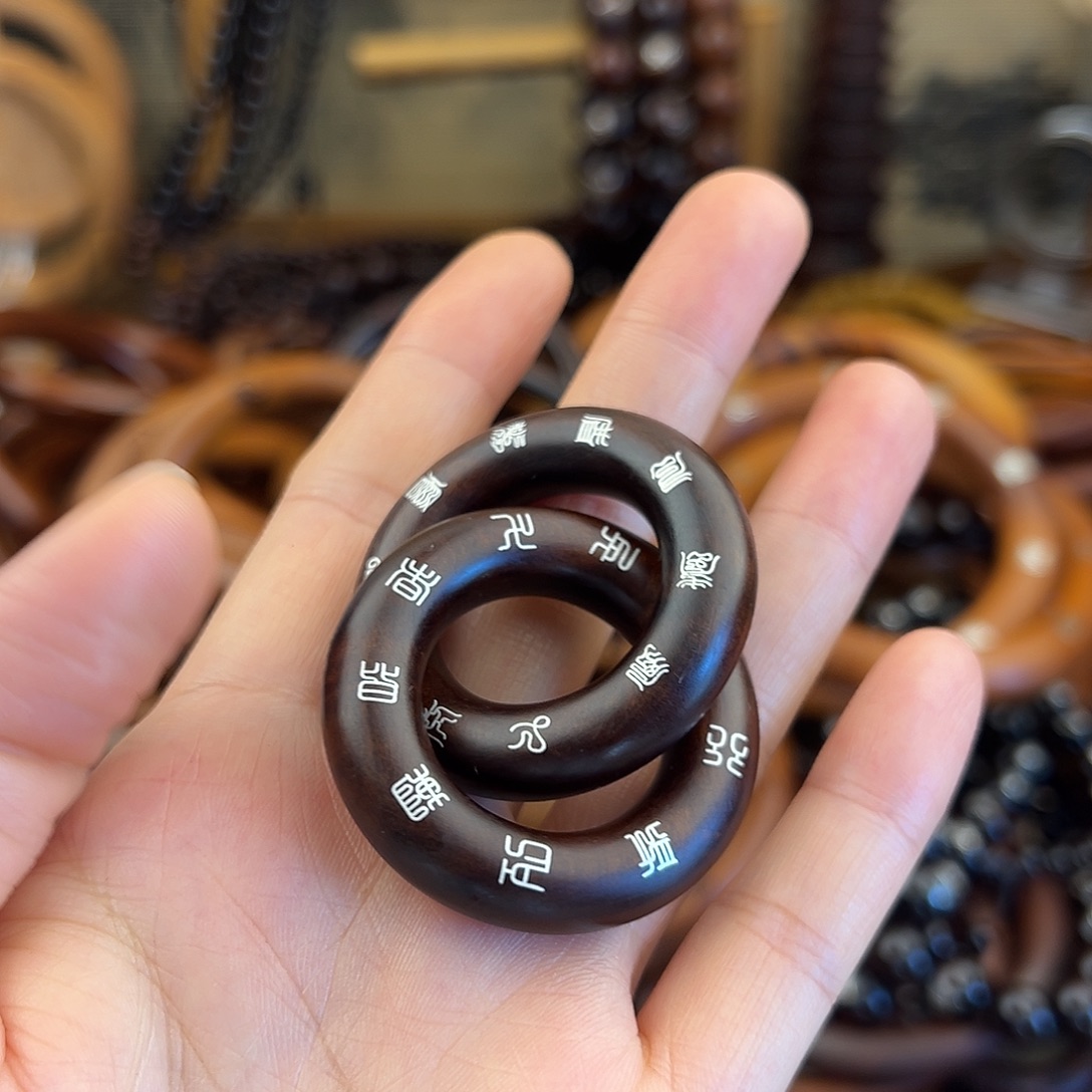 欧***窗2.5内径枣木玉化镶银乾坤圈