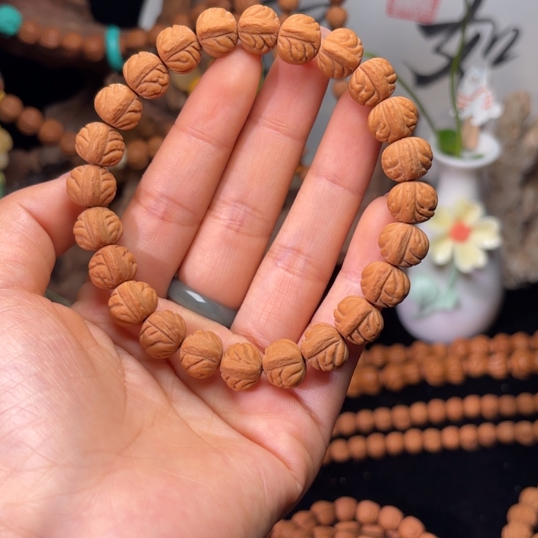 忠***艾桃核吊坠11尺寸小金豆原皮原色