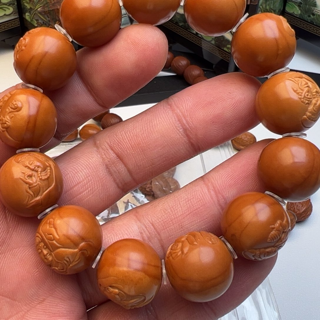 橄榄核吊坠越**好光珠浮雕观音