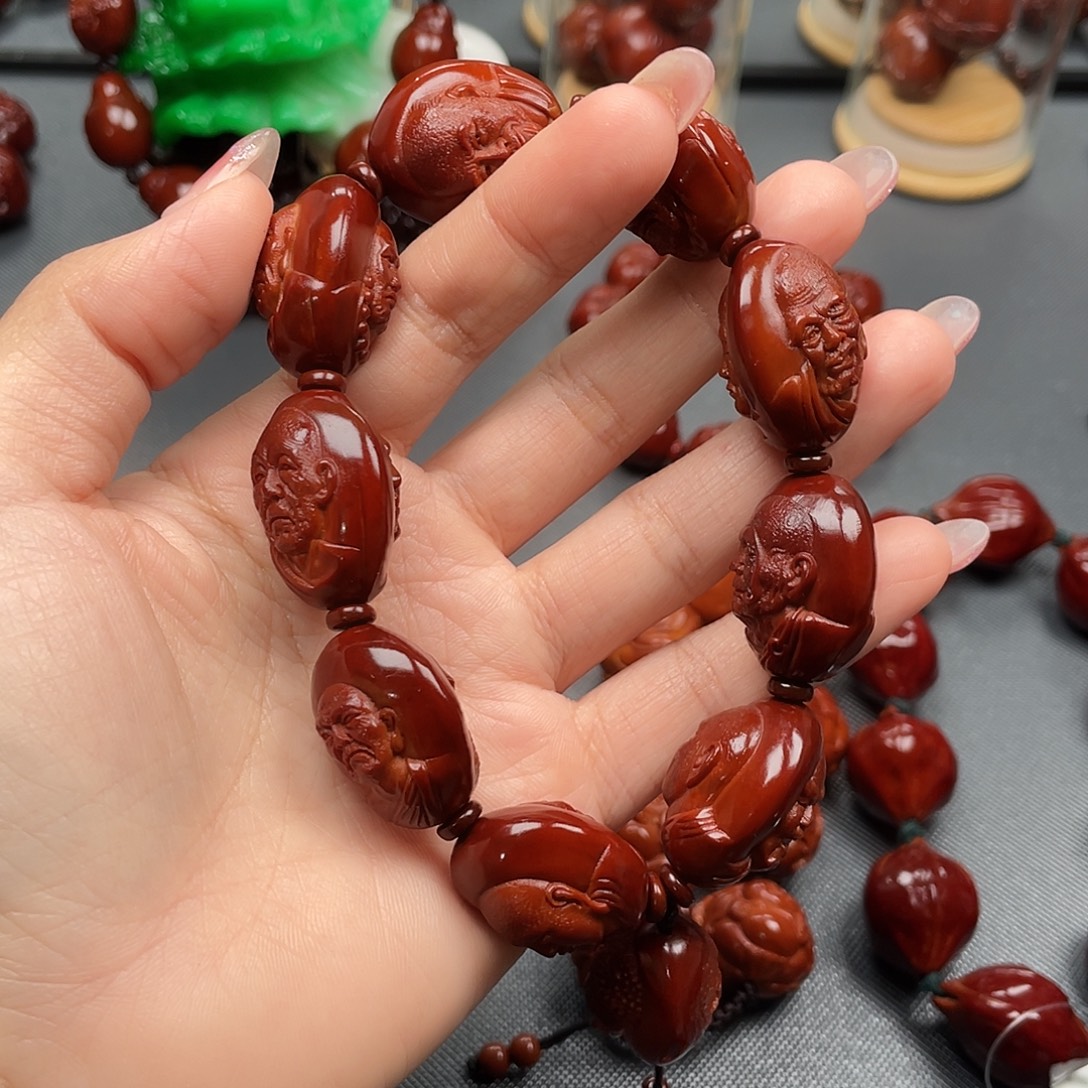 张***俊橄榄核手串十八罗汉