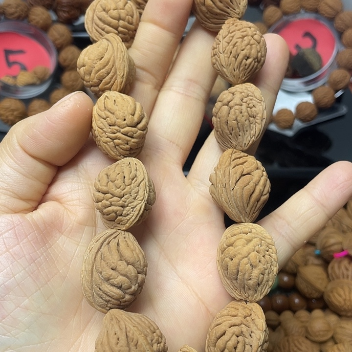 假***风桃核把件桃枭手持21尺寸15颗