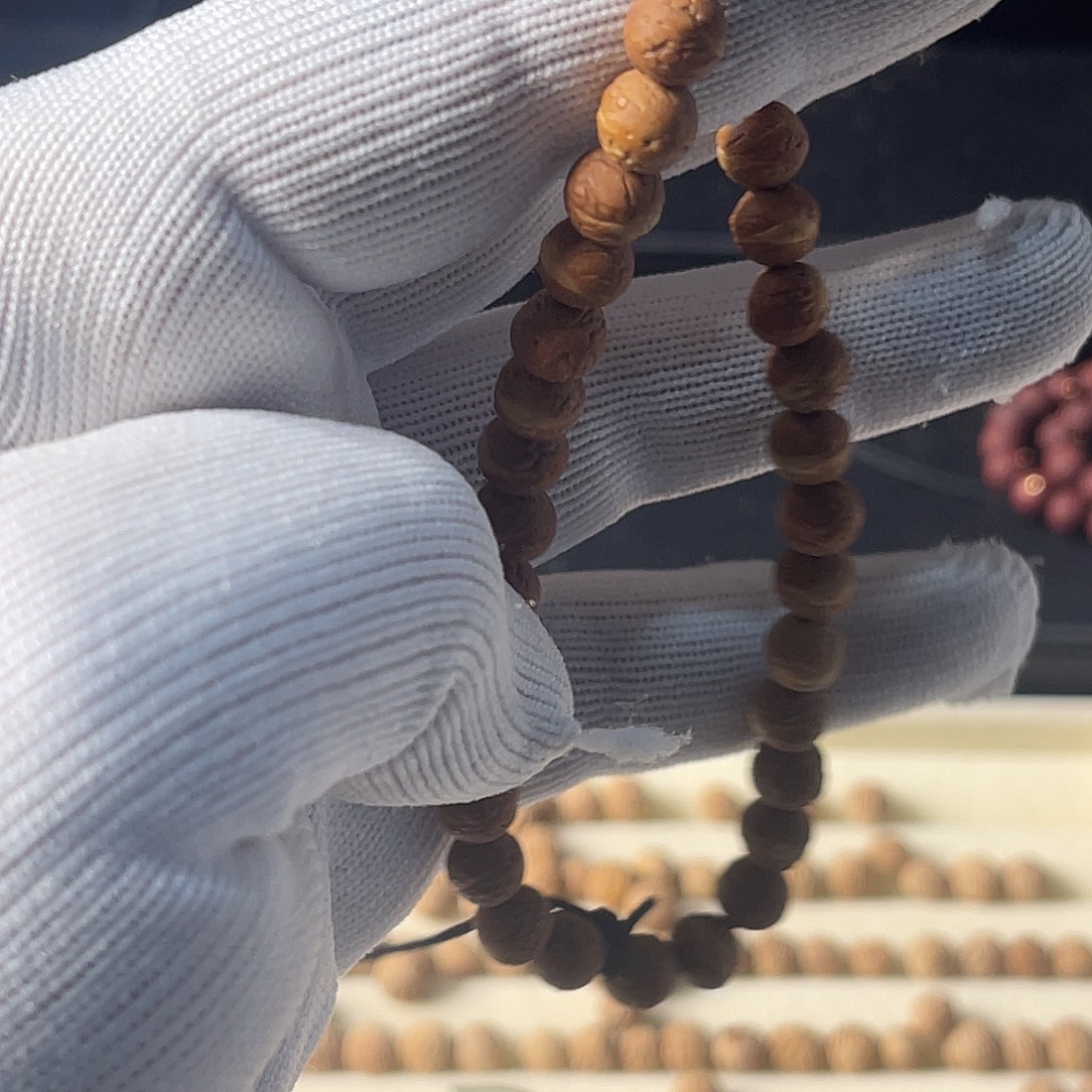 齐***巽木质非金属纯铜酸枣核手持