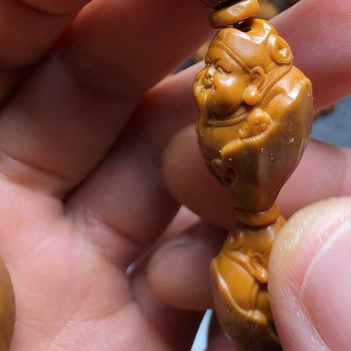 橄榄核把件你的手机