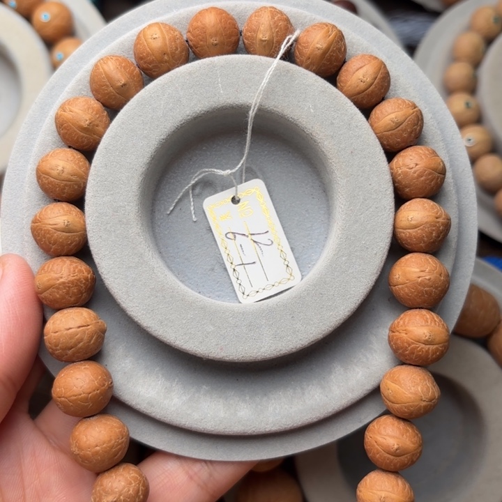 凤眼菩提吊坠12m m手持