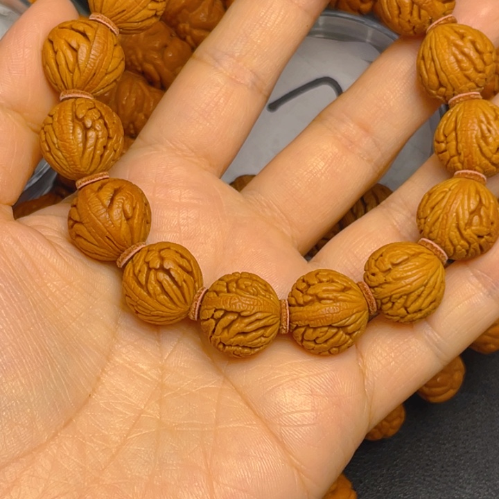 诸***绘桃核手串龙纹桃核手串