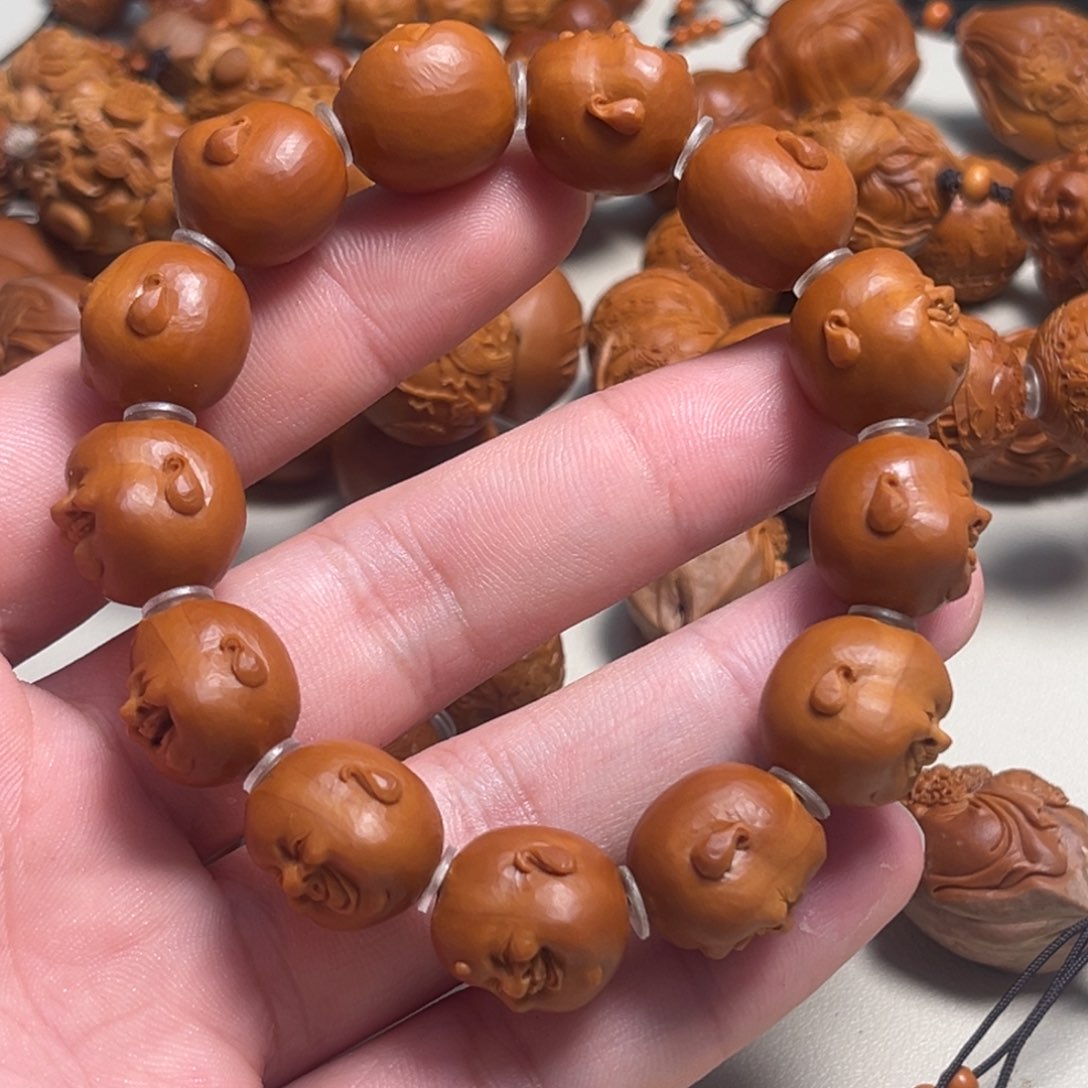 橄榄核吊坠侯**?人生百态