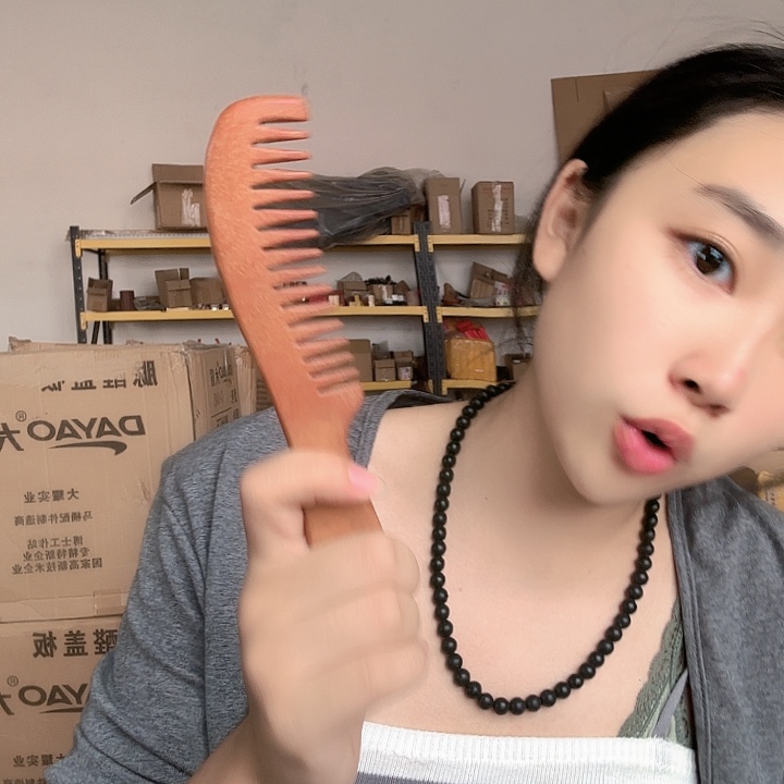 泗水砭石月牙湾手把件梳