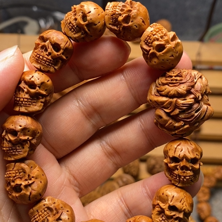 桃核手工雕刻骷髅手串