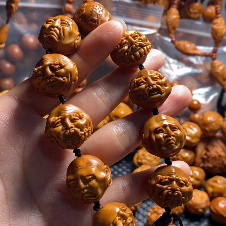 橄榄核吊坠老须派