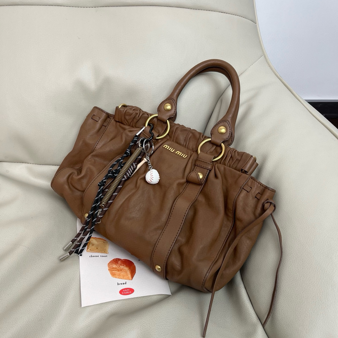 95新 MIU MIU/缪缪 棕色油蜡皮机车单肩包