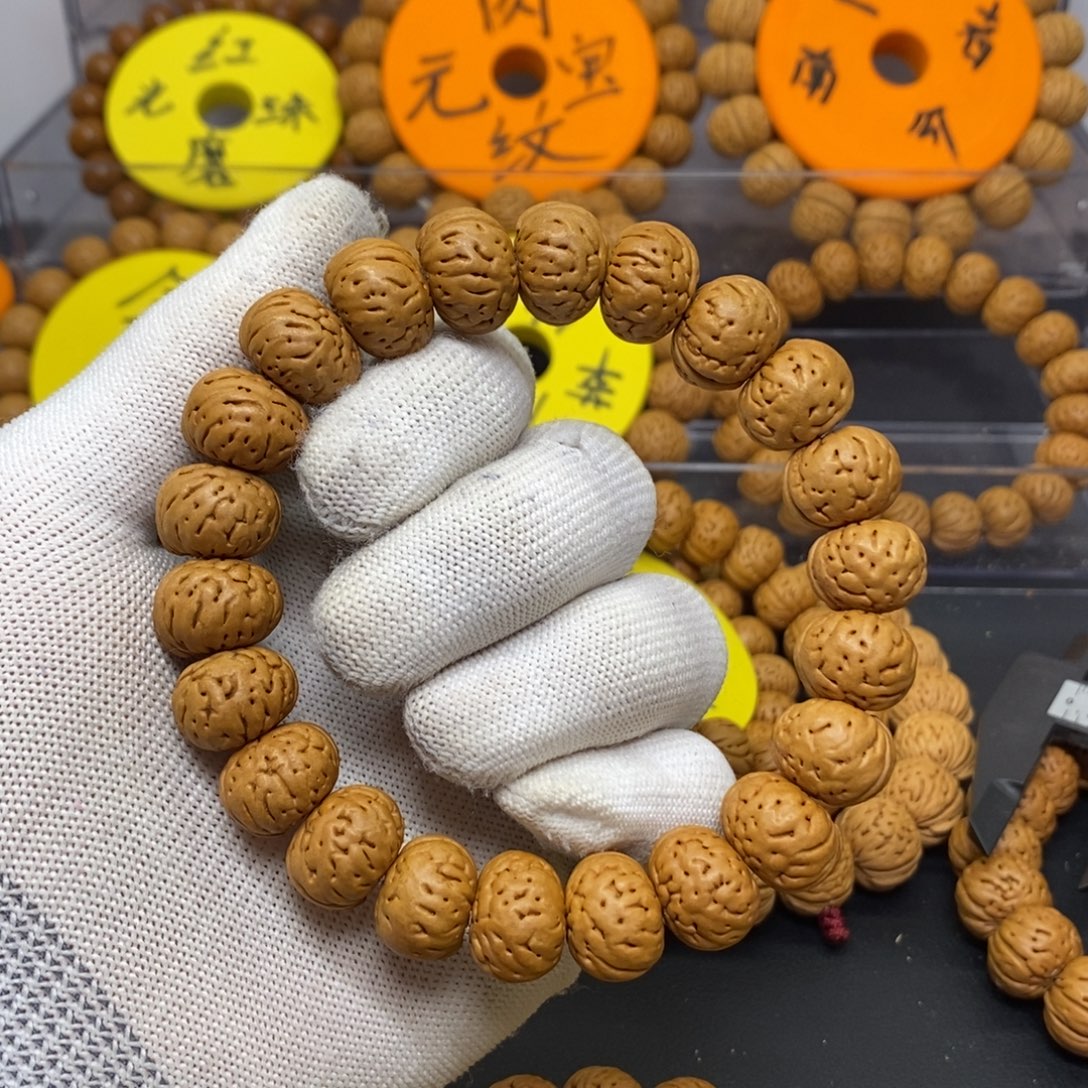 为***城桃核手串树王纽扣桃核手串