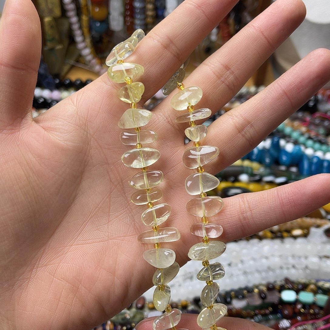 玛瑙/玉髓未镶嵌珠宝半成品柠檬晶中孔长牙一条