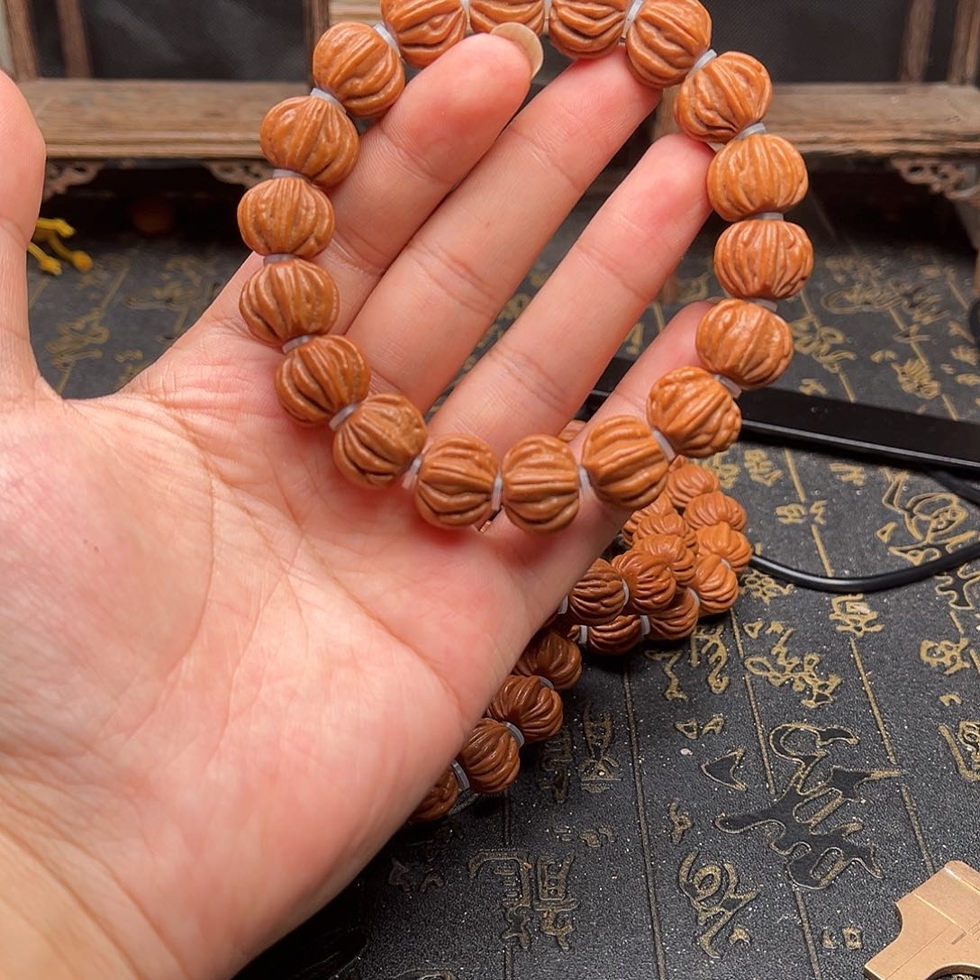 桃核吊坠佛手手串