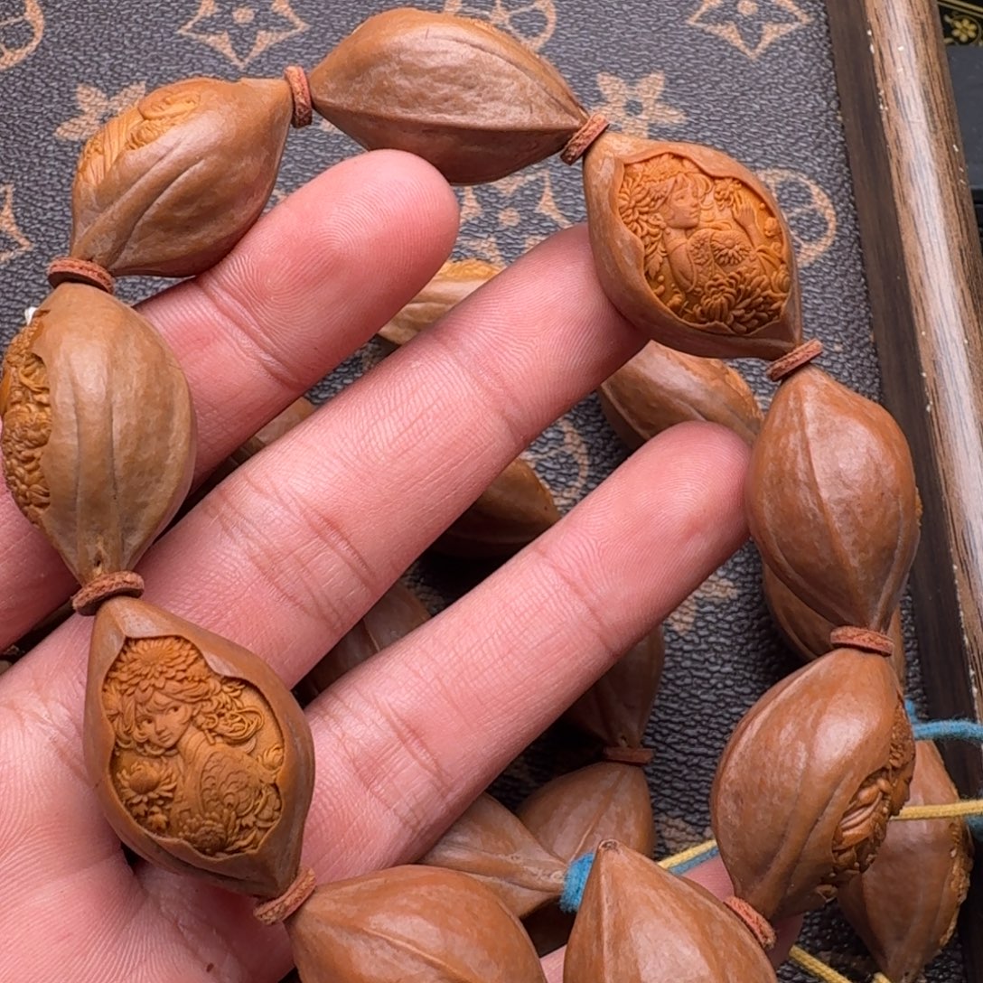 熊***平橄榄核手串/手链花仙子