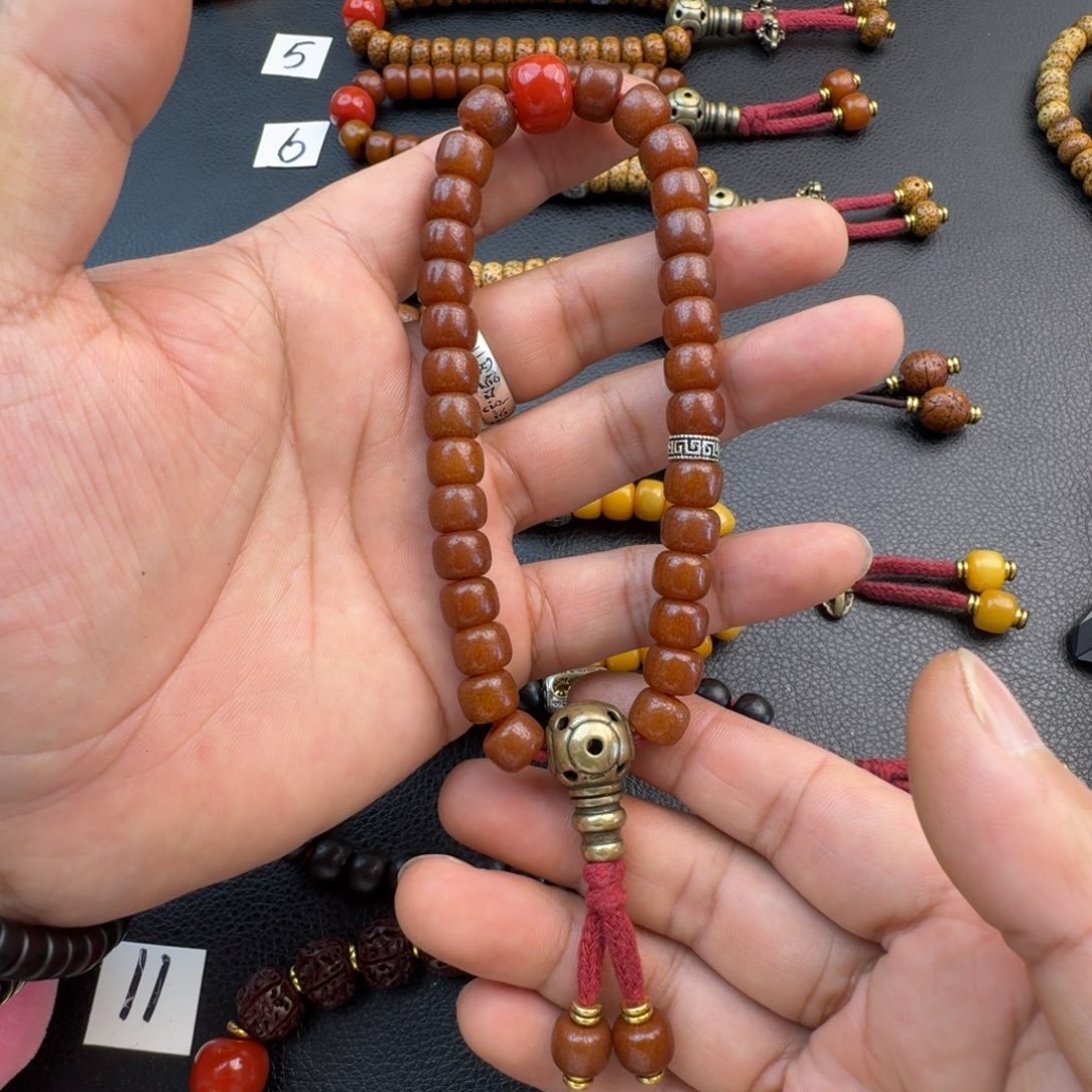 泥塑昂**杰菩提根手持