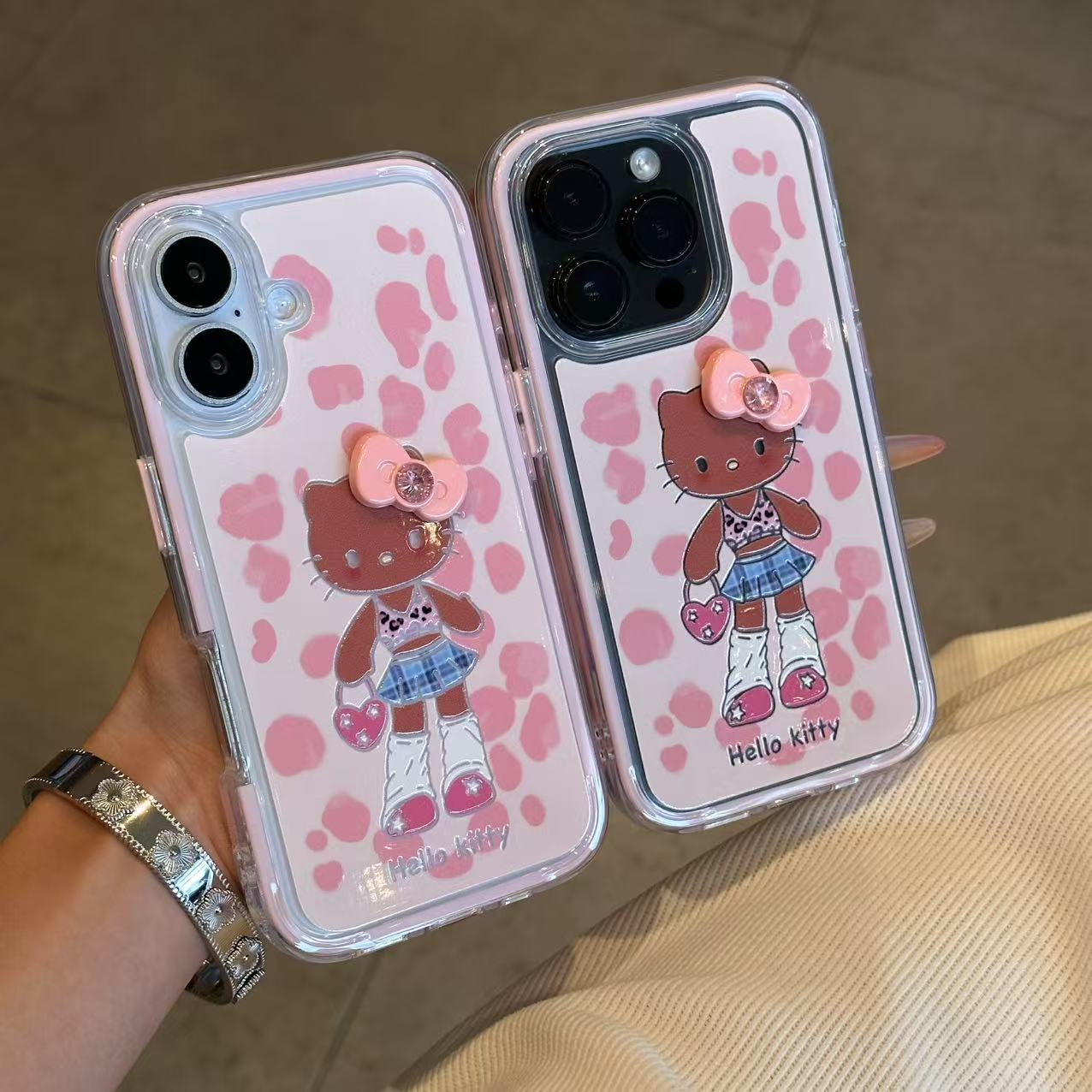 欧克里里长腿黑皮Kitty蝴蝶结适用苹果16手机壳华为vivo小米oppo