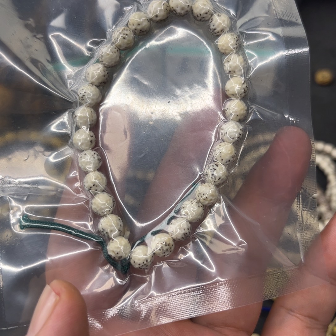 乌***头星月菩提吊坠8圆龙蛋手雕 魔纹 手持