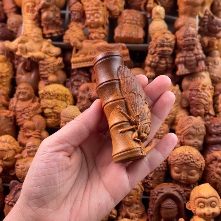 崖柏一物一拍手把件