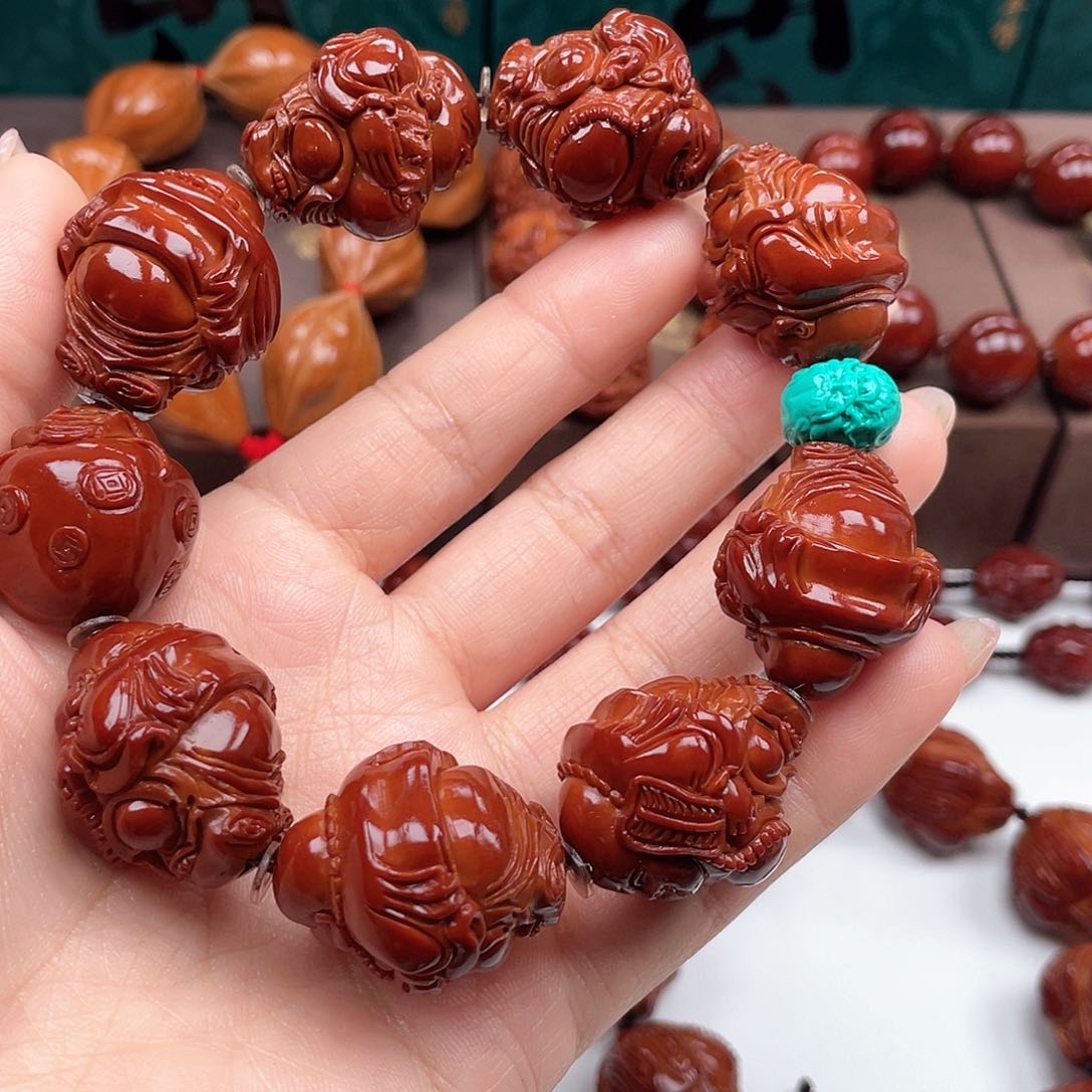 橄榄核手串翱**翼弥勒手串