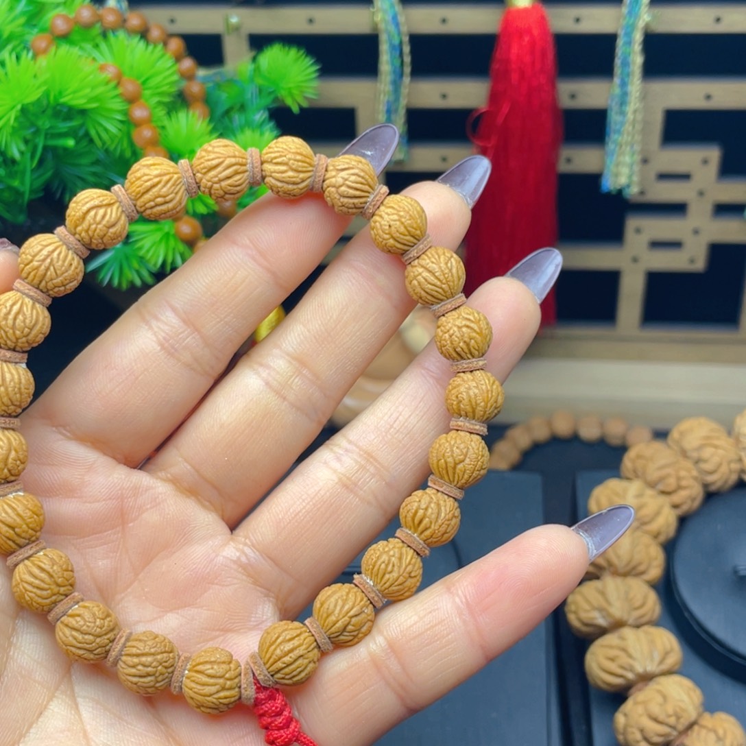 黎***樾桃核手串红红火火。红红火火