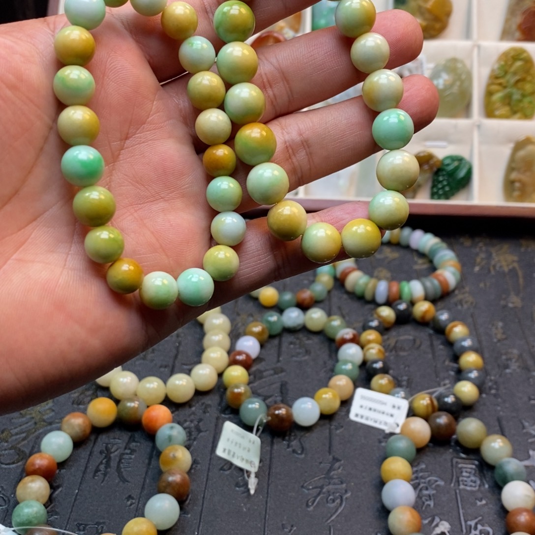 洗****翡翠未镶嵌手串黄加绿