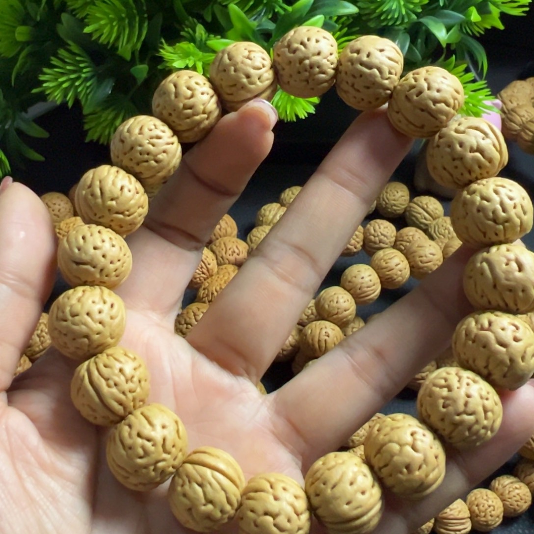 石***锤桃木金丹桃核手串