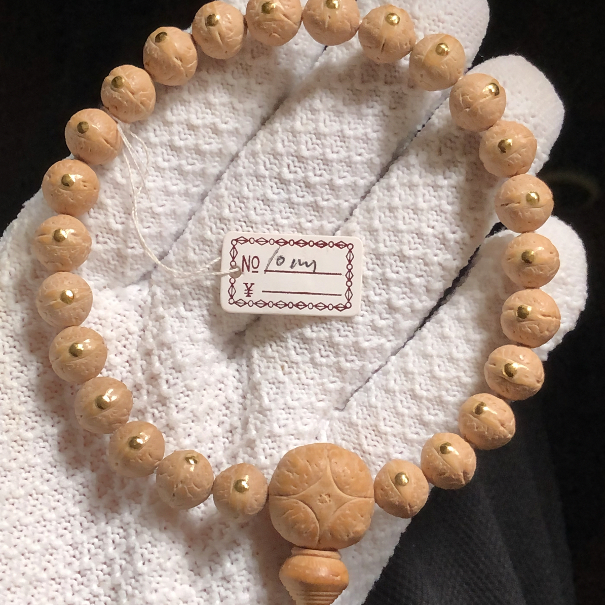 10mm实心籽姜黄皮镶嵌金钉尼泊尔凤眼手串（22增2）一物一图