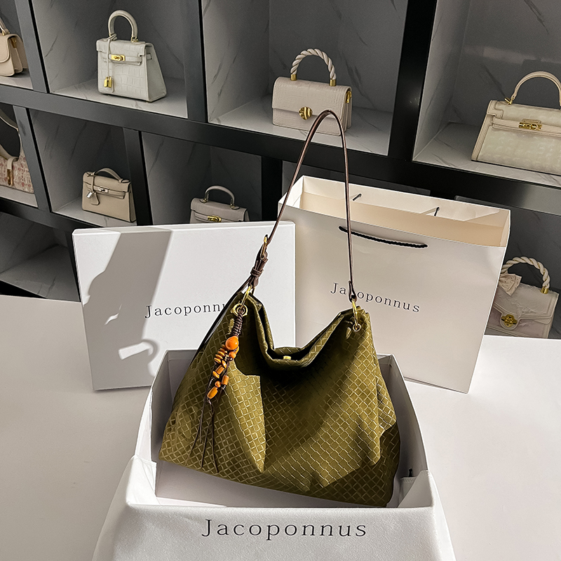 【设计师款】雅丹真皮编织纹水桶包2025新款轻奢小拎斜挎