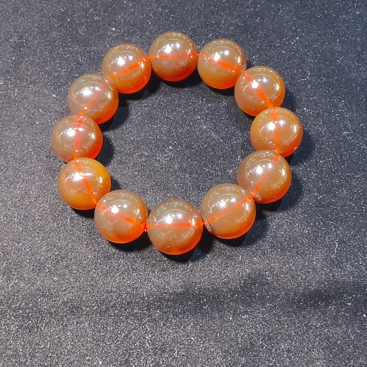 杨****琥珀未镶嵌手链棕红手串，干净，重53.1克