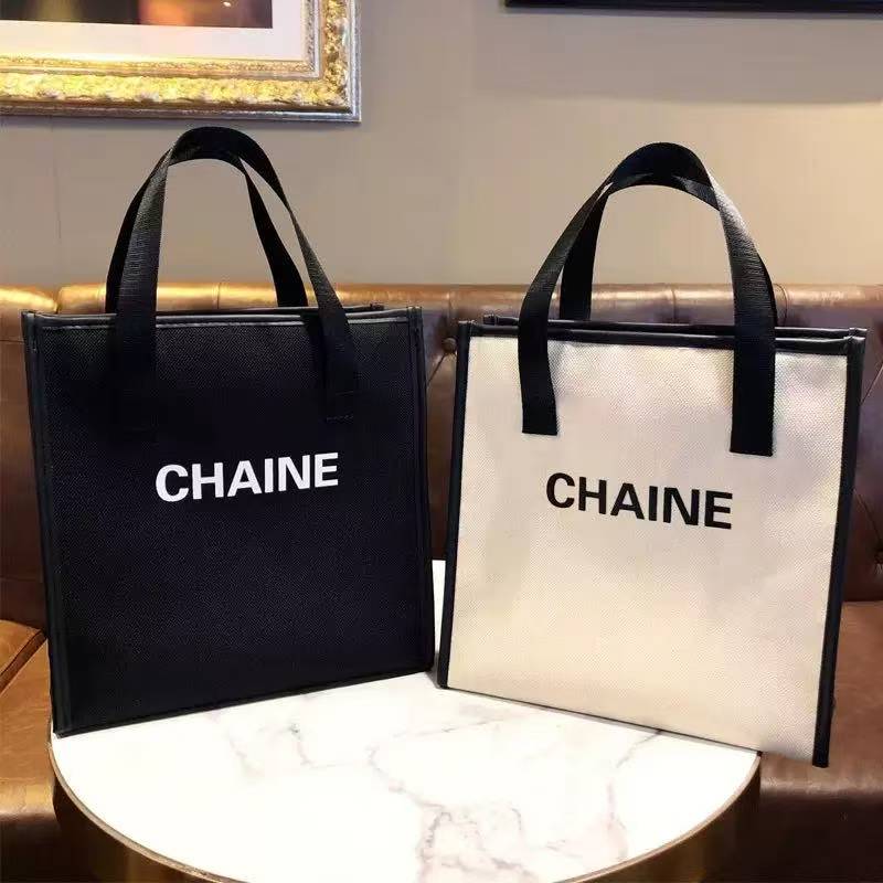 简约化妆包上班便携欧美风帆布字母手提袋时尚四方大容量收纳包