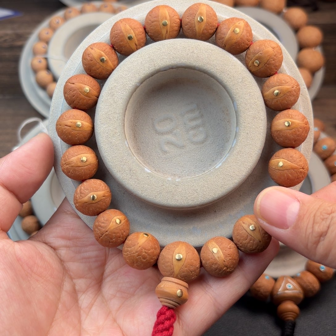 凤眼菩提手串14.5mm红皮黄金眼镶嵌