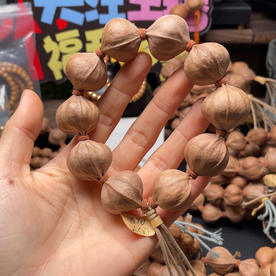 兖***业吊坠橄榄核2627四花铁核